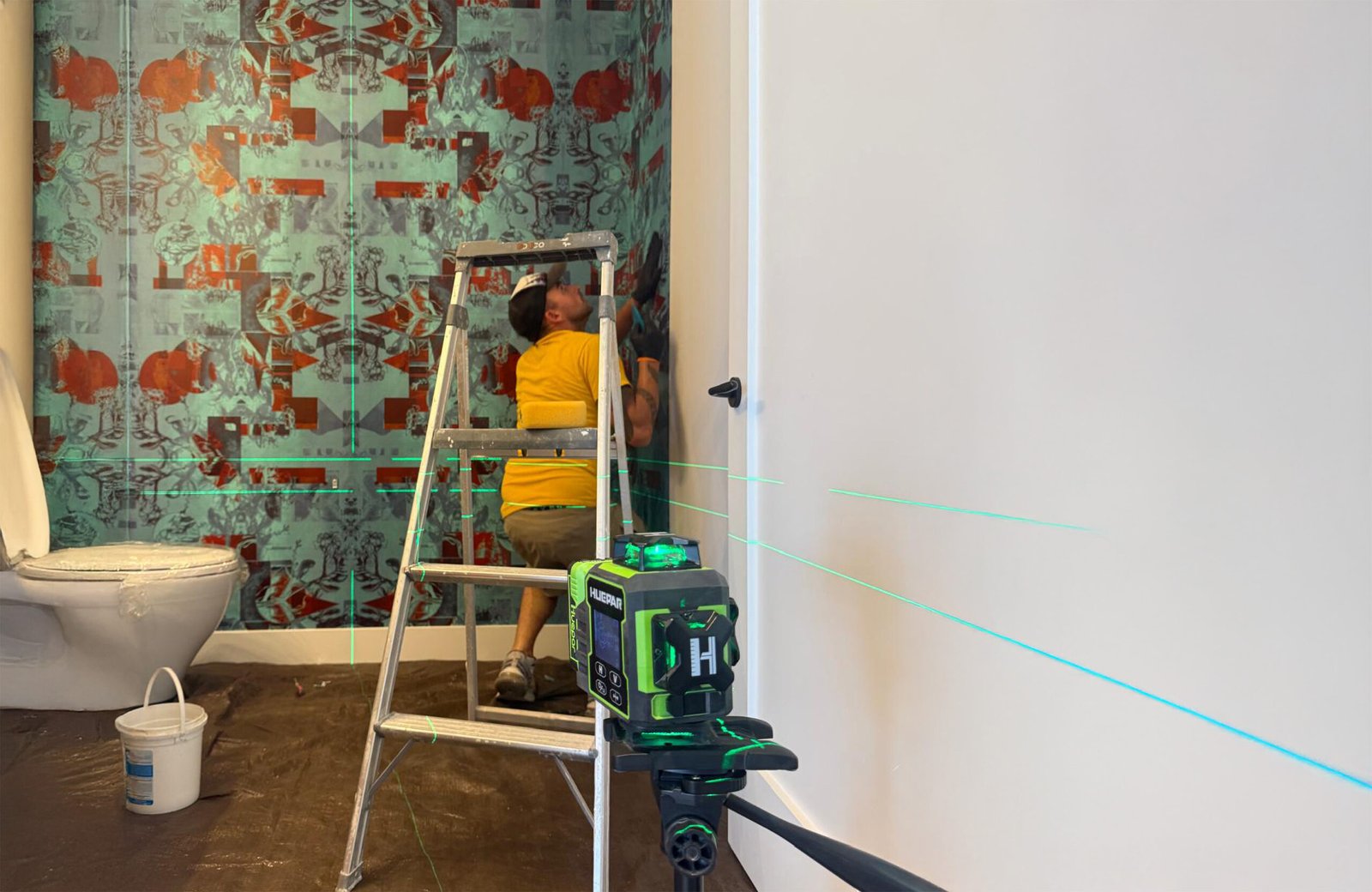 Professional wallpaper installation in progress